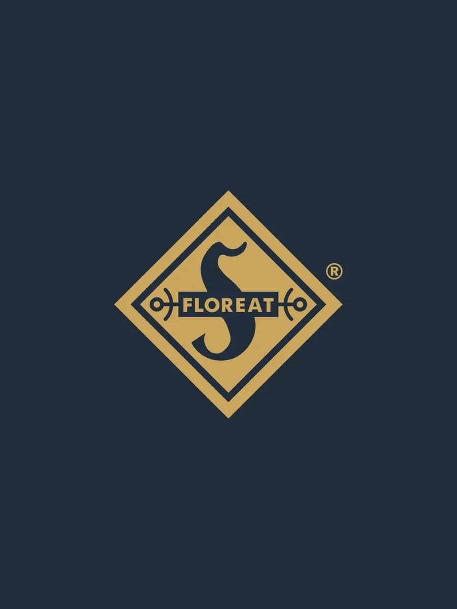 FLOREAT-Rautenlogo in Gold auf dunklem Marineblau