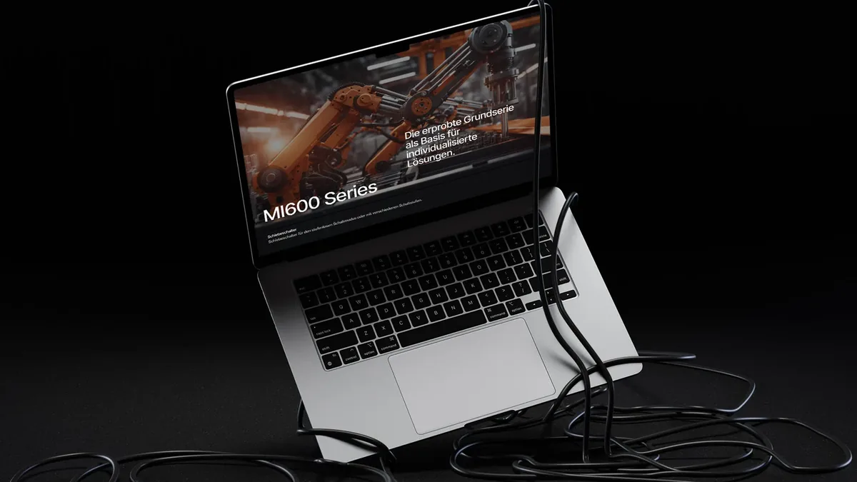 Aufgeklappter Laptop mit der Produktseite MI600 Series vor schwarzem Grund